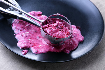 Plate with scoop of tasty yogurt ice cream on table, closeup