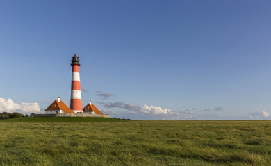 Fototapeta na wymiar Colorful lighthouse at Westerhever, Germany
