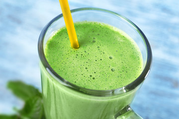 Glass of green healthy juice, closeup