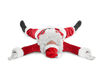 Exhausted Santa Claus lying isolated on white