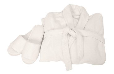 Folded bathrobe and bathing slippers on white background