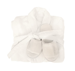 Folded bathrobe and bathing slippers on white background