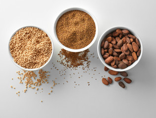 Composition with assortment of superfood products in bowls on white background, top view