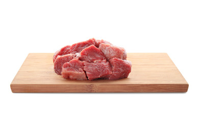 Wooden board with pieces of fresh raw meat on white background