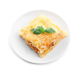 Portion of tasty lasagna, isolated on white
