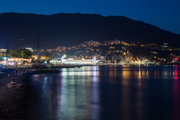 Fototapeta na wymiar Scenic night panoramic view of Black Sea harbor and port in Yalta