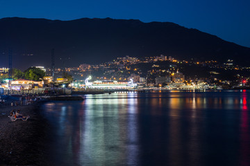 Fototapeta premium Scenic night panoramic view of Black Sea harbor and port in Yalta