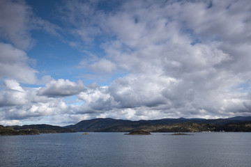 sea with smooth water and dramatic cloudy sky