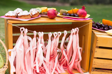 Fruits on the plate, orange, kiwi, pomegranate, grape, cherry. Photo decoration. Romantic
