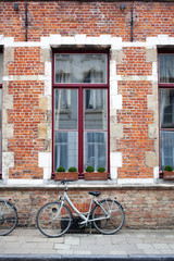 Fototapeta na wymiar Vintage bicycle in front of old brick wall
