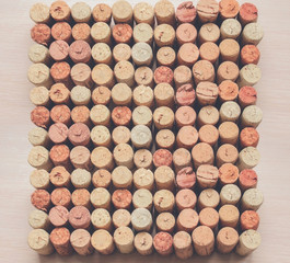Various wine corks on a wooden table