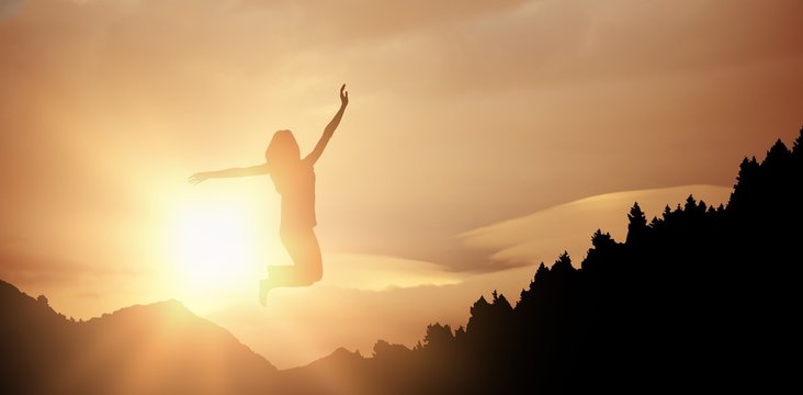 Composite image of woman jumping and smiling