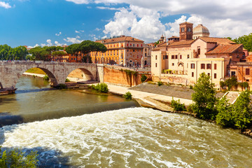 View of the Tiber island or Isola Tiberina with Pons Cestius and Basilica of St Bartholomew in...