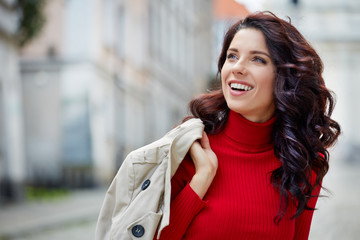 Beautiful woman in autumn style in town. Fashionable concept