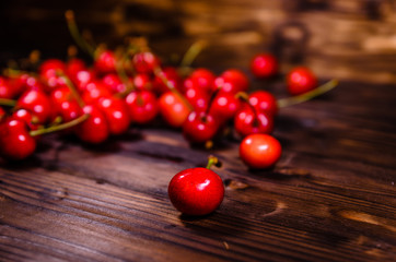 Fresh ripe cherries on wooden table