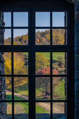 Holloko Castle in Hungary and autumn park around