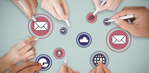 Composite image of business people writing with chalks