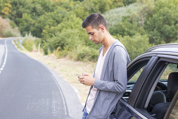 man in the car with the mobile phone