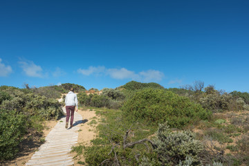 Woman hiking over sand dune in Coorong National Park - 170372983