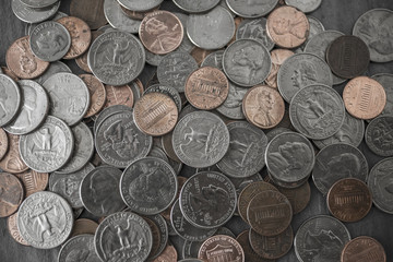 Loose change, pennies, nickels, dimes and quarters