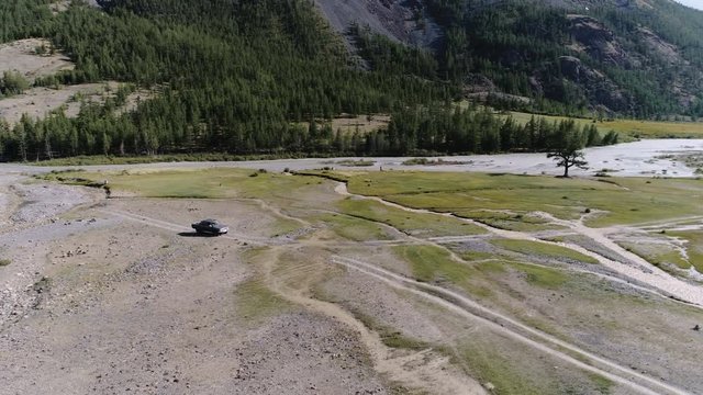 aerial view for vehicle off-road on dirty road of greek mountain 4k slow motion aerial shot..