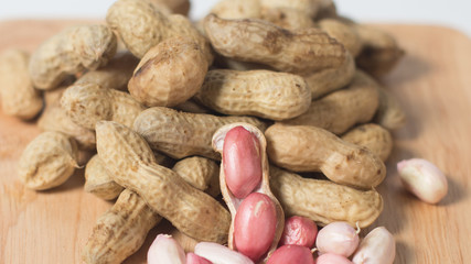 Peeled peanut on well peanuts,peanuts in the Wooden cup
