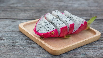 Dragon fruit on old wood background