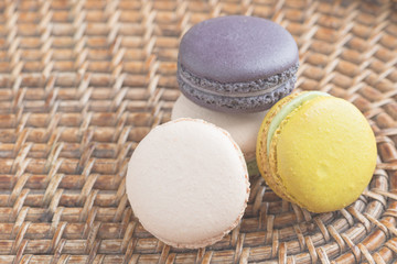 Colorful macaroons. Sweet macarons on retro  background .