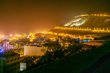 View hill on beach in Agadir city at night, Morocco