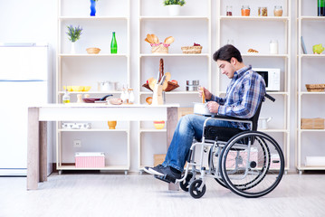 Disabled man preparing soup at kitchen