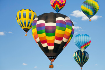 Obraz premium Hot air balloons up in the blue sky
