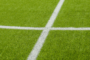 Obraz premium The white Line marking on the artificial green grass soccer field