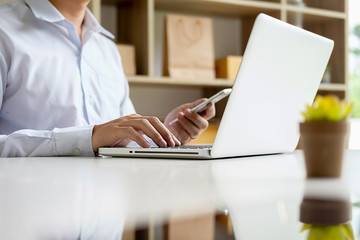 Teenager owner work at home for online shopping checking order product with office equipment