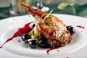 Fried duck leg with mini-pancakes