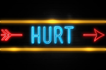 Obraz premium Hurt - fluorescent Neon Sign on brickwall Front view