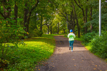 Healthy lifestyle. Copy space. woman jogging in the autumn park