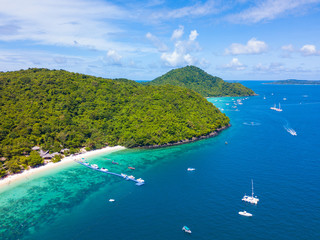 Aerial view or top view of tropical island beach with clear water at Banana beach, Coral Island, Koh Hey, Phuket