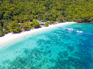 Aerial view or top view of tropical island beach with clear water at Banana beach, Coral Island, Koh Hey, Phuket