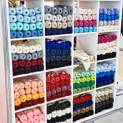 Clews colored wool on shelves of store