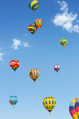 Hot air balloons up in the blue sky