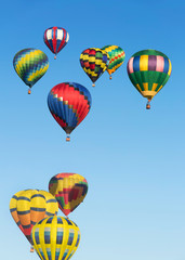 Hot air balloons up in the blue sky