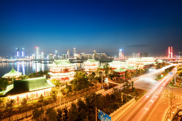 Fototapeta na wymiar cityscape and skyline of downtown near water of chongqing at night