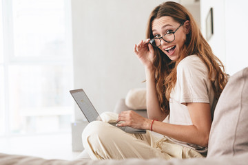 Happy amazing pretty lady using tablet computer.