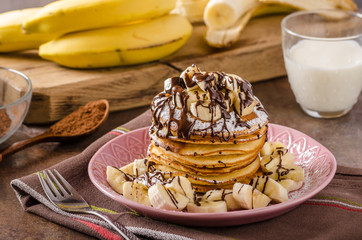 American pancakes with banana, chocolate