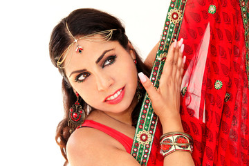 Woman dancing Indian dance in national dress. A handsome beautiful girl portrait in red Hindu...