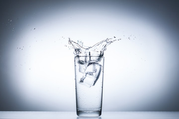 water splash in glasses isolated on white