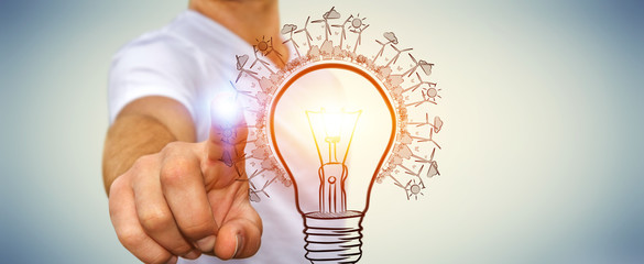 Businessman touching renewable eco lightbulb sketch