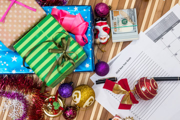new year goals 2018 with calendar, cristmas touy and dollar cash