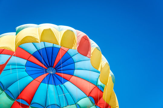 Colorful parasail wing pulled by the sea ,Phuket,Thailand.