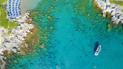 August 2017: Aerial drone photo of famous beach of Ladiko near iconic Anthony Quinn Bay, Rodos island, Aegean, Dodecanese, Greece - obrazy, fototapety, plakaty